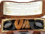 a suitcase with a pair of binoculars inside of it