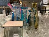 bottles and glasses on a counter in a store