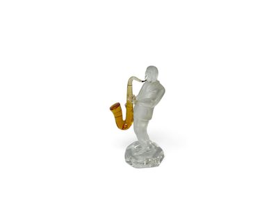 figurine of a man playing a saxophone on a white background