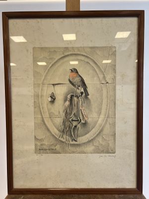 an old picture of a bird perched on a branch in a frame