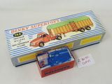 a box with a toy truck in it on a table