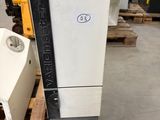a machine that is sitting on a pallet in a warehouse