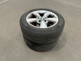 a tire that is sitting on the ground next to a tire