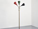 floor lamp in the shape of three red, green, and black lamps on a wooden pole