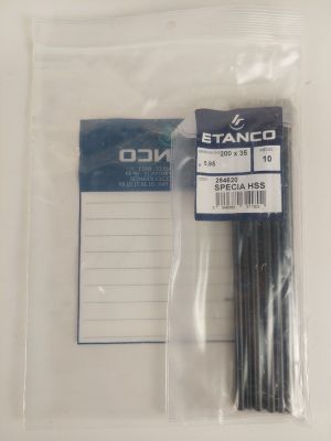 a plastic bag with a bunch of black sticks inside of it
