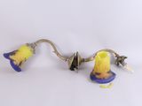 une paire d'appliques murales en verre jaune et bleu sur fond blanc