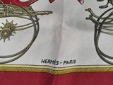 a red and white scarf with a picture of a horse and carriage on it