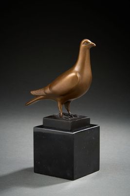 an image of a bronze bird on a black marble base
