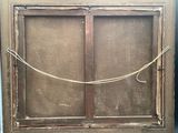 a picture of an old window with a rope hanging from it