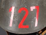 a helmet with the number 121 on it