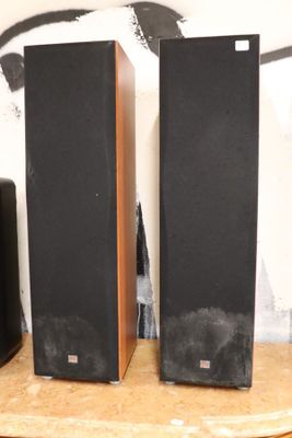 two speakers that are sitting on top of a table