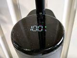 a clock on the side of a blender on a counter
