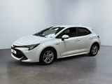 a white toyota corollant parked in a white room