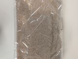 a brown sweater in a plastic bag on a white table