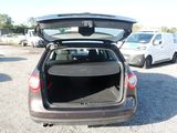 a car with its trunk open in a parking lot