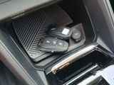 a car dashboard with a bunch of remote controls in it
