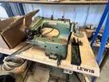 a sewing machine sitting on a table in a workshop