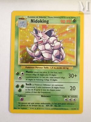 the pokemon card is hanging on the wall in the room
