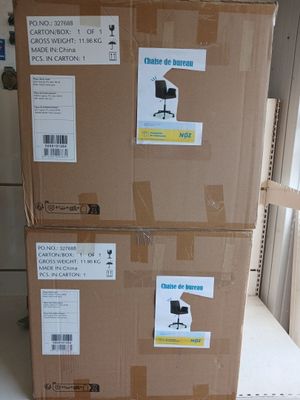 boxes are stacked on top of each other in a room