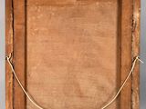 an old wooden frame with a rope hanging from it ' s side