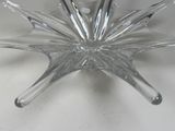 a clear glass bowl with a star shaped design on it