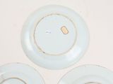 three plates that are sitting on a table