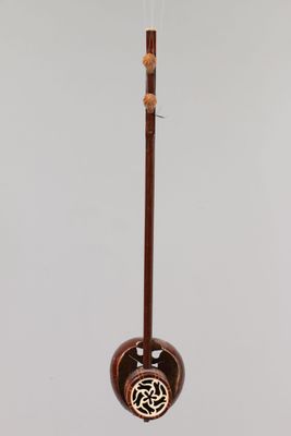 chinese musical instrument hanging from the ceiling on a white background