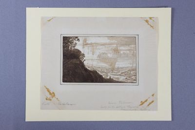 an image of a picture of a man sitting on top of a cliff