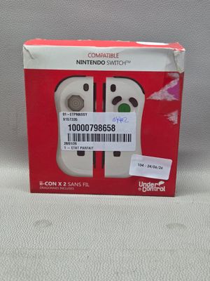 emballage d'une manette Nintendo Wii posée sur une table blanche