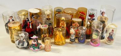 a lot of glass bottles with figurines inside of them