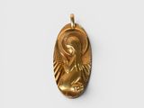a gold pendant with an image of a woman holding a baby