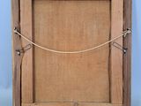 an old wooden picture frame with a rope around it on a blue background