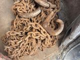a large pile of chains sitting on the side of a truck