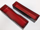 pair of red rectangular trays on a white surface