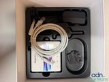 a box with a cable and a charger inside of it