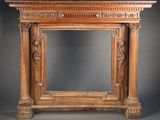 an image of a wooden fireplace with carvings on top of it