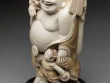 an image of a statue of a laughing buddha holding a baby