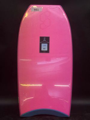 a pink surfboard sitting on top of a black surface