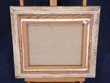 an old wooden easel with a painting on top of it on a blue background