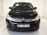 a picture of a black citrole parked in a white room
