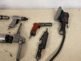 a lot of tools that are laying out on the floor