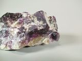 a piece of amethorate on a white surface