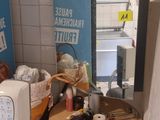 an image of a small kitchen with a microwave and toaster on a table