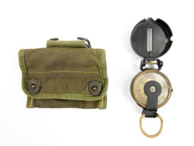 a small pocket with a compass and a pocket with a keychain