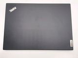 a laptop that is sitting on a white surface