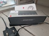 a radio sitting on top of a table next to a charger