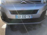 the front of a silver citrole parked in a parking lot