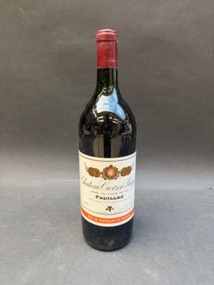 a bottle of wine that is sitting on a table