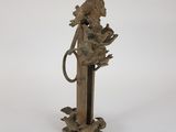 an old bronze statue of a woman with a bird on her shoulder