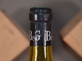 a bottle of wine that is sitting on a table